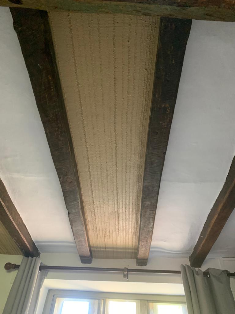 First coat of lime and horsehair plaster between two beams