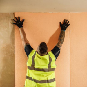 Isotherm being applied to a wall in a house suffering condensation