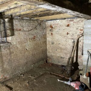 A collection of tools required to begin the work on the damp basement - dry storage space