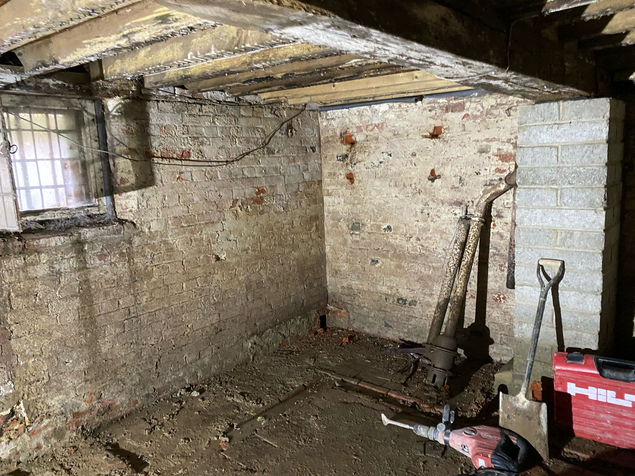 A collection of tools required to begin the work on the damp basement - dry storage space