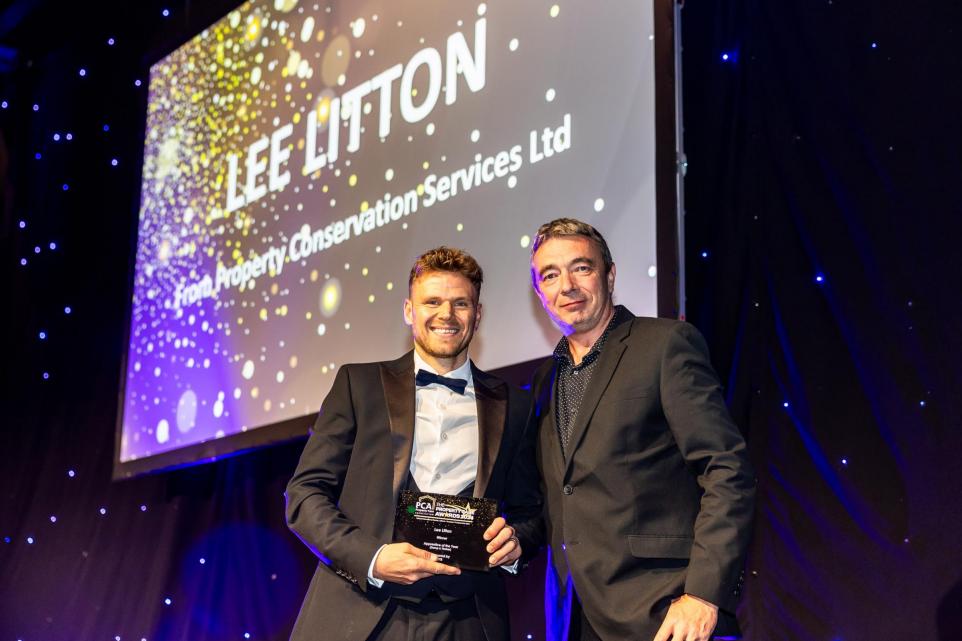 Lee Litton, damp specialist of Property Conservation Services, receiving his Property Care Apprentice of the Year Award