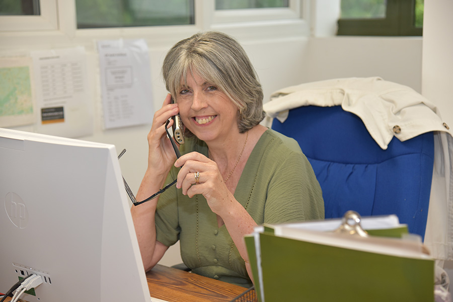 Property Conservation customer support representative arranging a survey.