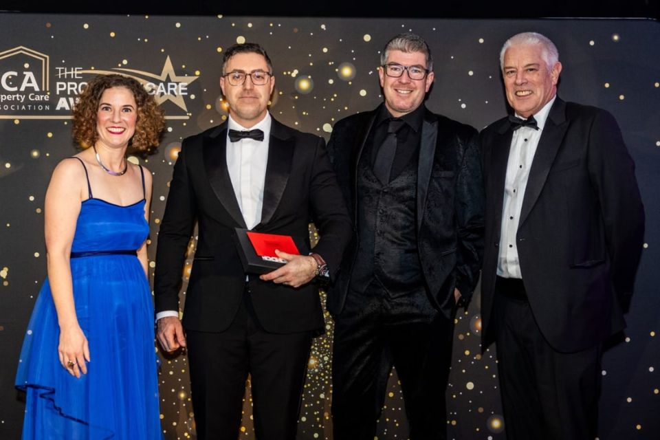 Steve Evans, on stage to receive his award from three members of the PCA and judging team