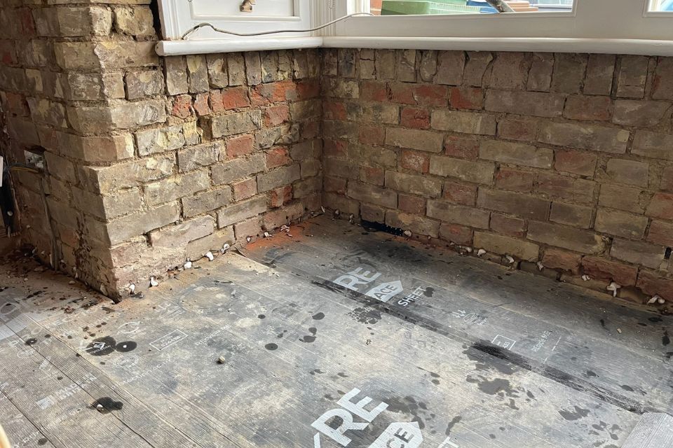 A chemical damp proof course injected in to a brick wall to stop rising damp and salt contamination