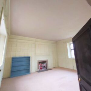 A wood-panelled room with a new lime plaster ceiling