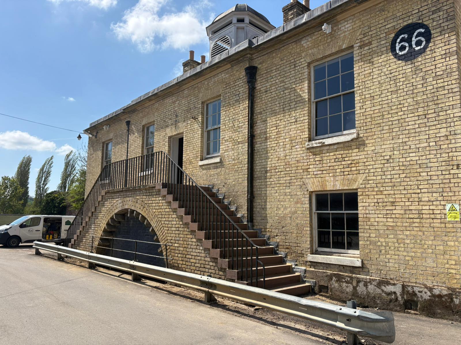 Exterior of the former warehouse with salt contamination behind disused fireplace