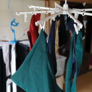 Laundry hanging from a small indoor clothes dryer